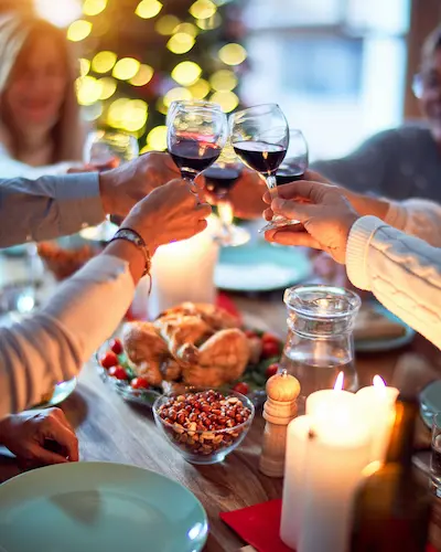 people around a table enjoying a meal.